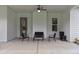 Covered patio features ceiling fan and seating arrangement for relaxing outdoors at 340 Taylor Path, Dallas, GA 30157