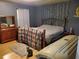 Bedroom with queen bed, wood dresser, wood laminate floors, and ample light at 3905 Hunters Chase, Conyers, GA 30094