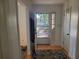 Bright entryway featuring hardwood floors and a storm door that lets in natural light at 3905 Hunters Chase, Conyers, GA 30094