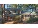 Charming two-story home featuring a mix of brick and stone, nestled among mature trees at 3905 Hunters Chase, Conyers, GA 30094
