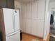 Kitchen with refrigerator and lots of built in storage cabinets for dry goods and supplies at 3905 Hunters Chase, Conyers, GA 30094