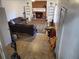 Open living room featuring a brick fireplace, built-in shelves and tile flooring at 3905 Hunters Chase, Conyers, GA 30094