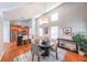 Inviting dining area with a round table, hardwood floors, and a seamless flow to the modern kitchen at 837 Forrest Se Cir, Atlanta, GA 30354