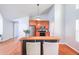 Modern kitchen with a breakfast bar, stainless steel appliances, hardwood floors, and an open concept design at 837 Forrest Se Cir, Atlanta, GA 30354