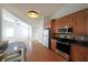 Modern kitchen with stainless steel appliances, wooden cabinets, and sleek countertops that enhance the cooking experience at 837 Forrest Se Cir, Atlanta, GA 30354