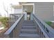 Stairway leading to the front door with a painted gray handrail at 837 Forrest Se Cir, Atlanta, GA 30354