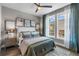 Well-lit bedroom with stylish decor, large windows, ceiling fan, and comfortable bedding at 1160 Ormewood Ave # 13, Atlanta, GA 30316