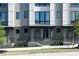 Modern townhome exterior with clean lines, well-maintained landscaping, and individual entryways at 1160 Ormewood Ave # 13, Atlanta, GA 30316