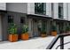 Modern townhome exterior featuring a row of units with gray siding and decorative landscaping at 1160 Ormewood Ave # 13, Atlanta, GA 30316