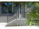 Modern home's front entrance with sleek black railings and gray tones at 1160 Ormewood Ave # 13, Atlanta, GA 30316