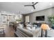 Open concept living room with stylish furniture, television, and view to kitchen at 1160 Ormewood Ave # 13, Atlanta, GA 30316