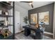 Home office with modern décor, dark walls, stylish desk, and ample shelving at 1160 Ormewood Ave # 13, Atlanta, GA 30316