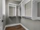 Bright walk-in closet with custom white shelving and hardwood floors, offering ample storage at 1160 Ormewood Ave # 13, Atlanta, GA 30316