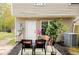 Cozy back patio with chairs, landscaping, and exterior of townhome at 1501 Eastern Sunrise Ln, Decatur, GA 30034