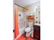 Cozy bathroom with tub and shower combo, orange accents, and decorative lighting at 1501 Eastern Sunrise Ln, Decatur, GA 30034