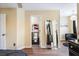 Bedroom featuring a full length mirror, doorway to bathroom, a ceiling fan, a sofa and a view to the bed at 1501 Eastern Sunrise Ln, Decatur, GA 30034