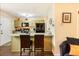 Open-concept kitchen with granite countertops, a breakfast bar, and modern appliances for cooking at 1501 Eastern Sunrise Ln, Decatur, GA 30034