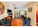 Inviting living room featuring a fireplace, TV, and access to a modern kitchen with bar seating at 1501 Eastern Sunrise Ln, Decatur, GA 30034