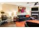 Comfortable living room showcasing a fireplace, TV, and well-appointed furniture under ceiling fan at 1501 Eastern Sunrise Ln, Decatur, GA 30034
