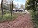 Spacious backyard with a two-story home, a deck, a screened porch and stone landscaping at 4002 Wieuca Ne Rd, Atlanta, GA 30342