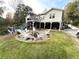Inviting backyard featuring an outdoor fire pit with a seating area, perfect for entertaining at 4002 Wieuca Ne Rd, Atlanta, GA 30342