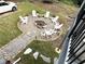 Aerial view of backyard fire pit area with lounge chairs on a stone bed at 4002 Wieuca Ne Rd, Atlanta, GA 30342