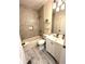 Stylish bathroom featuring patterned tile walls, and bright white fixtures at 4002 Wieuca Ne Rd, Atlanta, GA 30342