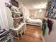 Light and airy bedroom featuring white furnishings, a desk, hardwood floors and natural light at 4002 Wieuca Ne Rd, Atlanta, GA 30342