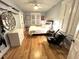 Light-filled bedroom with wood floors, a ceiling fan, and neutral decor, creating a calming and inviting atmosphere at 4002 Wieuca Ne Rd, Atlanta, GA 30342
