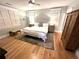 Spacious bedroom with light-colored walls, wood floors, and natural light from multiple windows at 4002 Wieuca Ne Rd, Atlanta, GA 30342