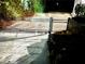 Wrought iron security gate securing the property entrance at night at 4002 Wieuca Ne Rd, Atlanta, GA 30342