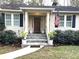 Inviting front entrance with stone steps and an elegant, paneled wood door at 4002 Wieuca Ne Rd, Atlanta, GA 30342