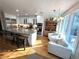 Bright eat-in kitchen with stainless appliances, a large island with seating, and light colored granite counters at 4002 Wieuca Ne Rd, Atlanta, GA 30342