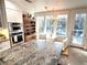 Kitchen island with granite countertops, stainless appliances, adjacent to a sitting area near large windows at 4002 Wieuca Ne Rd, Atlanta, GA 30342