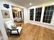 Bright sitting area with wood floors, large windows and white trim throughout the room at 4002 Wieuca Ne Rd, Atlanta, GA 30342
