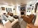 Inviting living room with a brick fireplace, built-in shelving, comfortable seating, and hardwood floors at 4002 Wieuca Ne Rd, Atlanta, GA 30342