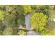 Aerial view of a home with mature trees providing ample shade and privacy at 5630 Lake Forrest Dr, Sandy Springs, GA 30342