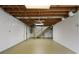 Spacious unfinished basement with updated ceiling and walls offering room for customization at 5630 Lake Forrest Dr, Sandy Springs, GA 30342