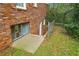 Exterior basement entrance with a concrete landing, offering convenience and access to the lower level at 5630 Lake Forrest Dr, Sandy Springs, GA 30342