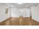 Bedroom features gleaming hardwood floors, a window for natural light, and closet for storage at 5630 Lake Forrest Dr, Sandy Springs, GA 30342