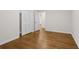 Bedroom with hardwood floors, bi-fold doors and neutral paint at 5630 Lake Forrest Dr, Sandy Springs, GA 30342