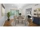 This dining room features hardwood floors, a chandelier, and a round table with four chairs at 5630 Lake Forrest Dr, Sandy Springs, GA 30342
