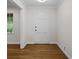 Bright foyer with hardwood floors and white trim, offering a welcoming entrance to the home at 5630 Lake Forrest Dr, Sandy Springs, GA 30342