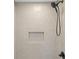 Modern shower features tan subway tile and modern fixtures at 5630 Lake Forrest Dr, Sandy Springs, GA 30342