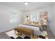Bright bedroom with natural light, a cozy bed, and modern decor at 794 Casplan St, Atlanta, GA 30310