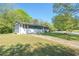House exterior featuring a well-maintained front yard, and long driveway at 794 Casplan St, Atlanta, GA 30310