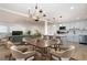 Open concept living space with dining area, kitchen, and modern lighting at 794 Casplan St, Atlanta, GA 30310