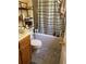 Simple bathroom featuring a vanity, toilet, and shower/tub with curtain at 109 Millwheel Dr, Villa Rica, GA 30180
