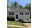 Charming two-story home with a cozy front yard and a driveway leading to an attached garage at 109 Millwheel Dr, Villa Rica, GA 30180