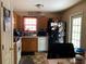 Practical kitchen featuring ample cabinet space, white appliances, and a dining area at 109 Millwheel Dr, Villa Rica, GA 30180